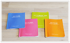 青、ピンク、黄緑、オレンジのスクール講習テキスト（4冊）
